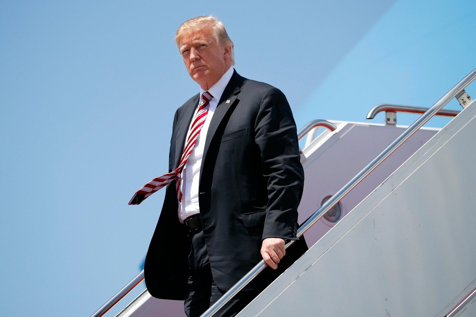 Donald Trump standing at plane stairs