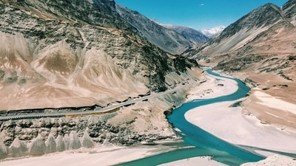 River Flowing Through a Mountain Valley – Symbolic Image